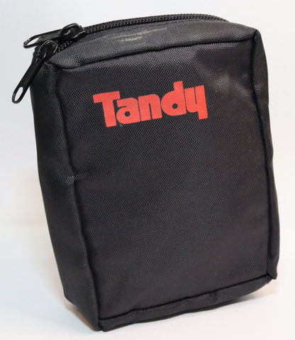 A black zippered fabric pouch with the brand name 'Tandy' printed in red across the front, photographed on a white studio background.